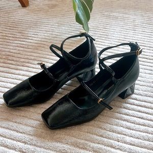 Brand new Mary Janes in black vinyl leather
